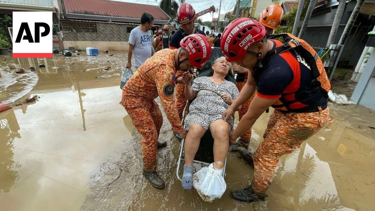 Typhoon sets off flash floods in the Philippines, trapping people on roofs