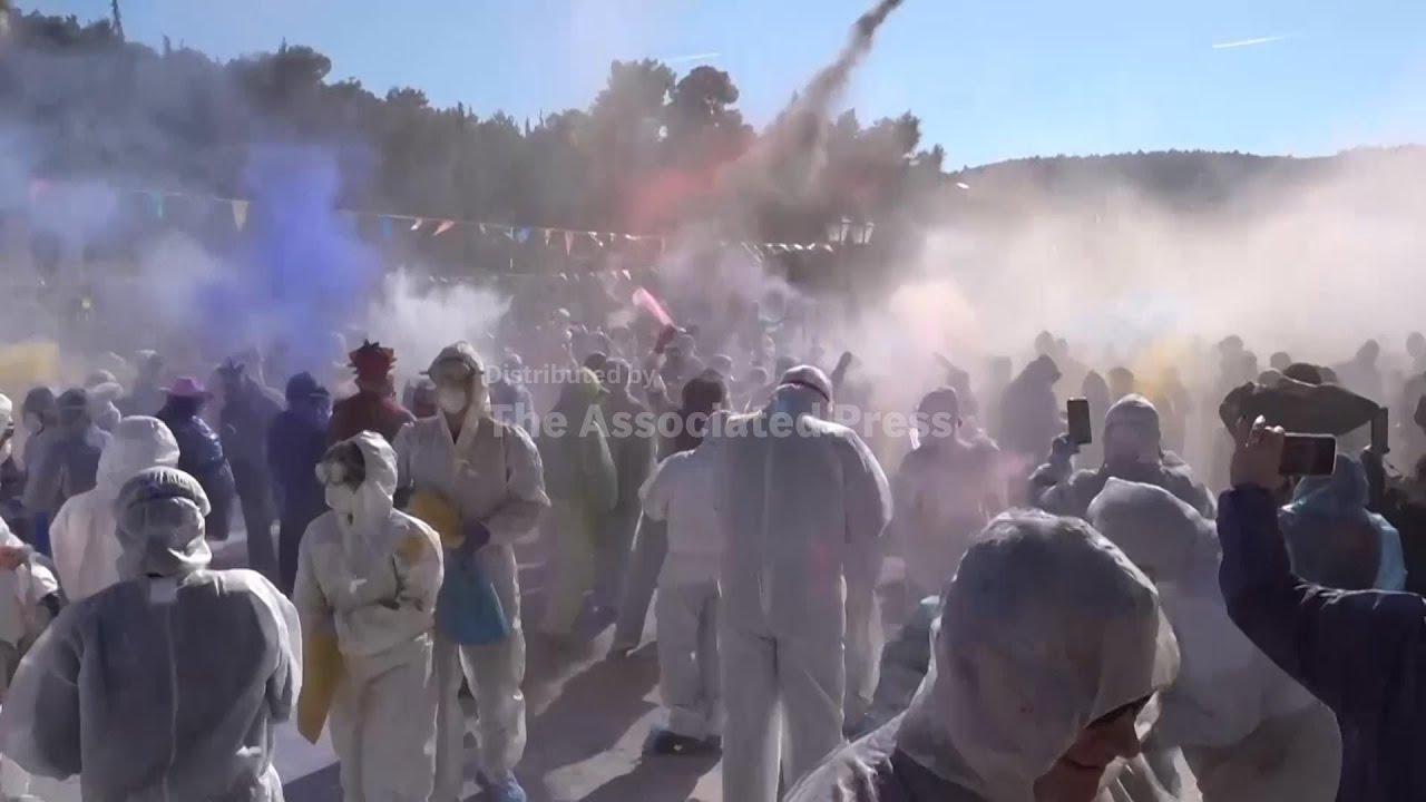 Greeks throw flour at each other to mark the end of carnival