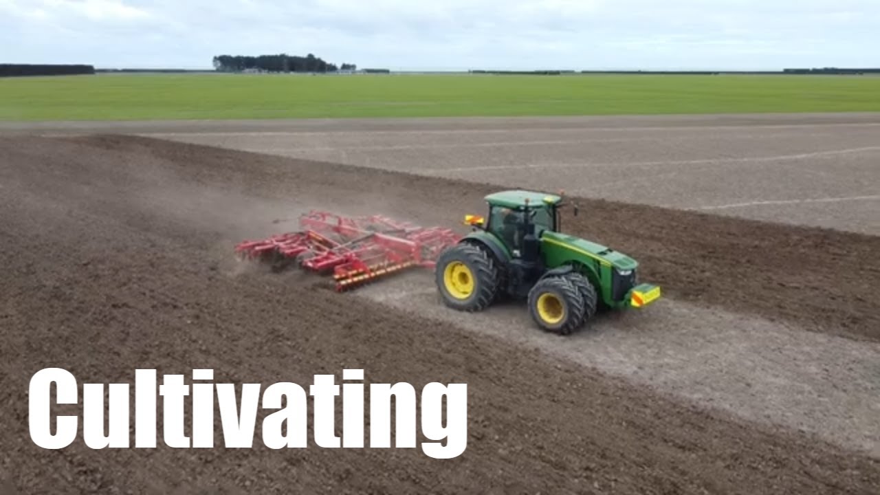 John Deere 8400R towing a Vaderstad Topdown 700 Cultivator