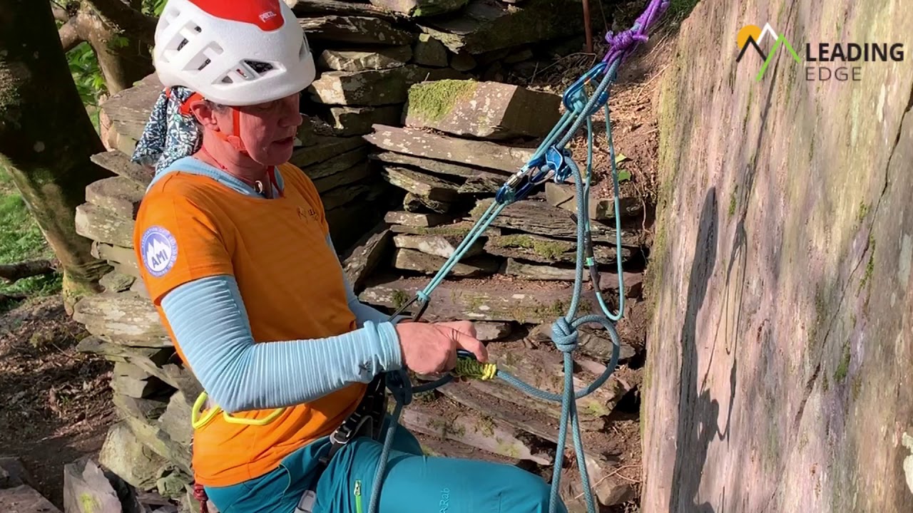 Abseiling past a knot.