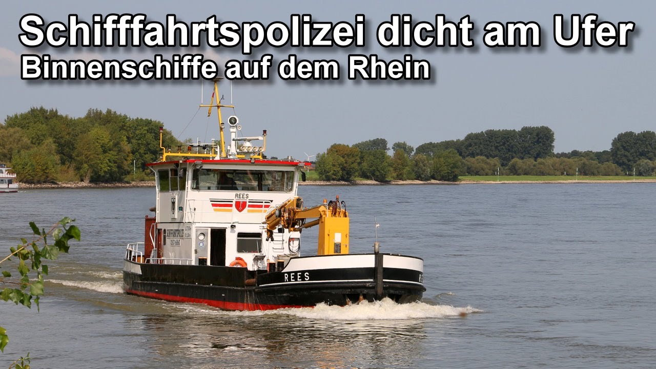 Schifffahrtspolizei dicht am Ufer - Binnenschiffe auf dem Rhein - Niederrhein Bislich