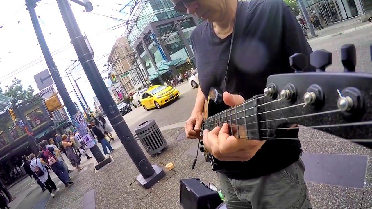 Watch busker play Dire Straits EPIC - Private investigations