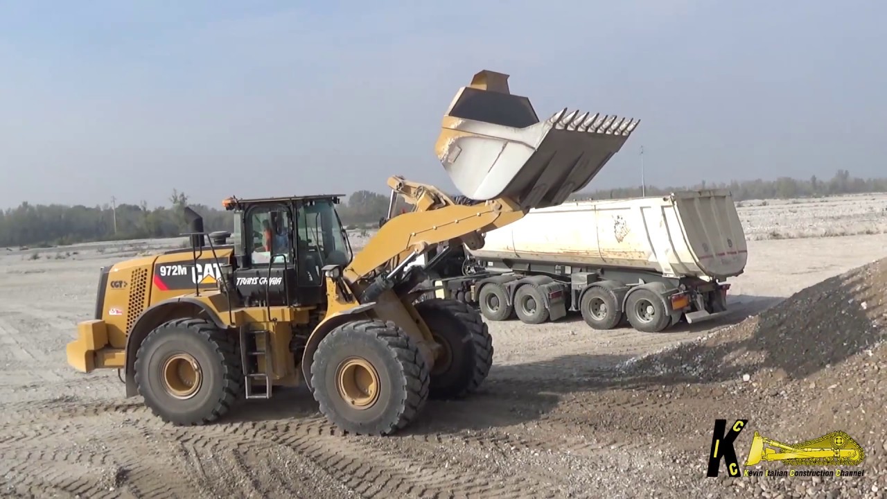 Caterpillar 972M Wheel Loader Digging Gravel in the River