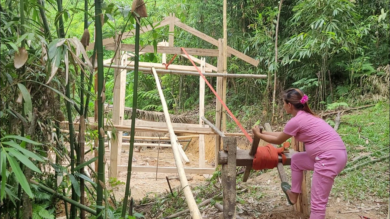 Pregnant woman builds a new stilt house.