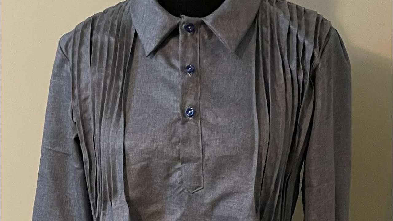 A pin tucked blouse with roll collar 