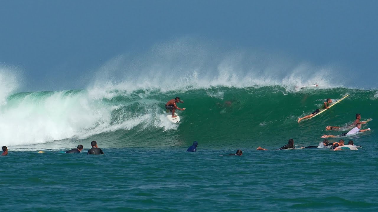 FREESURFERS IN A CROWDED KUTA REEF, CATCHING BARRELS AND FILMING FROM THE BOAT.