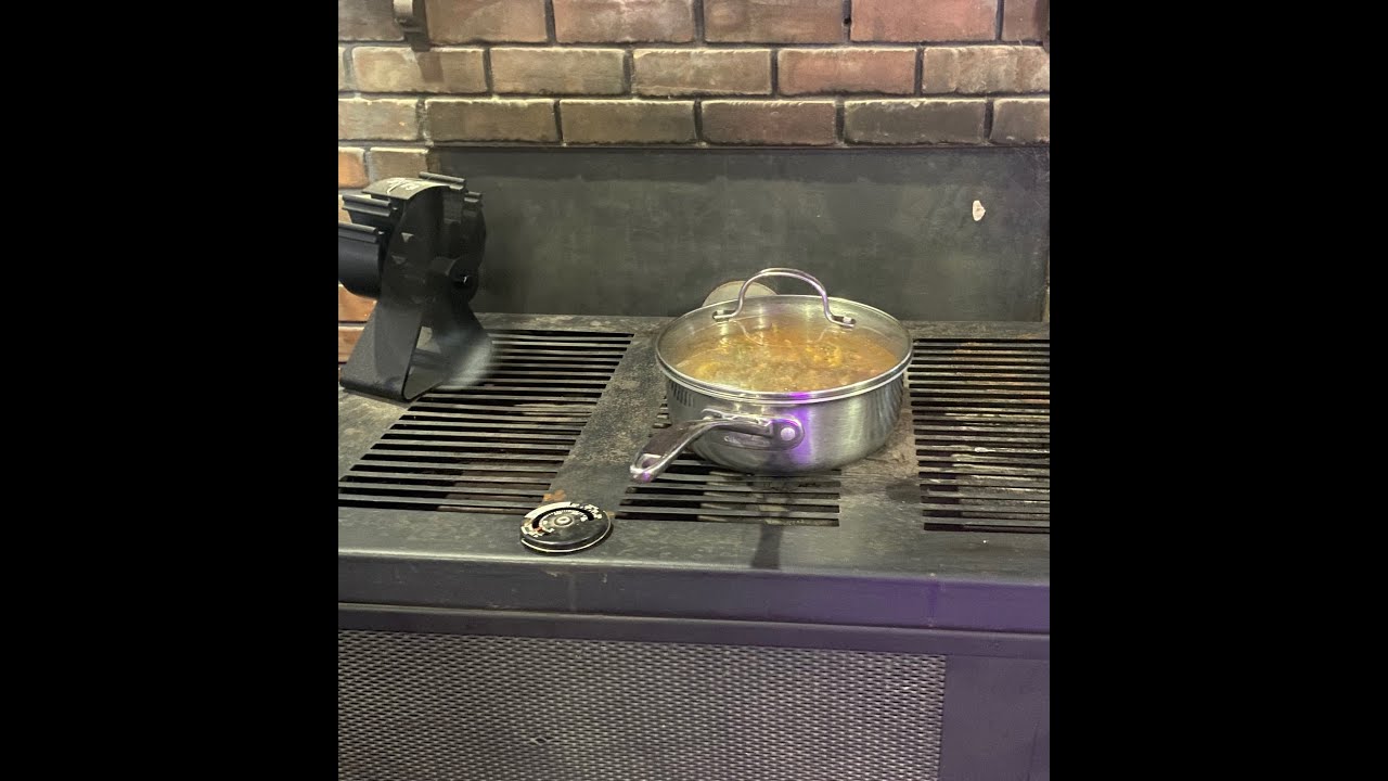 Cooking dinner on wood heater