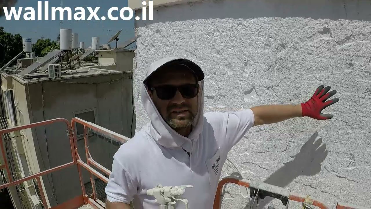 חיפוי קיר חיצוני בלוחות בפייבר צמנט בבית משותף ,ת