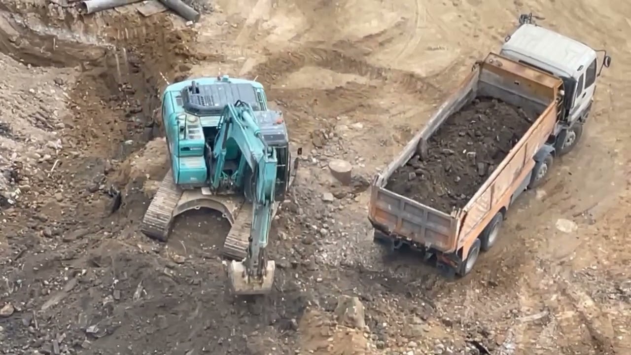 The Excavator cut & fill the construction area 