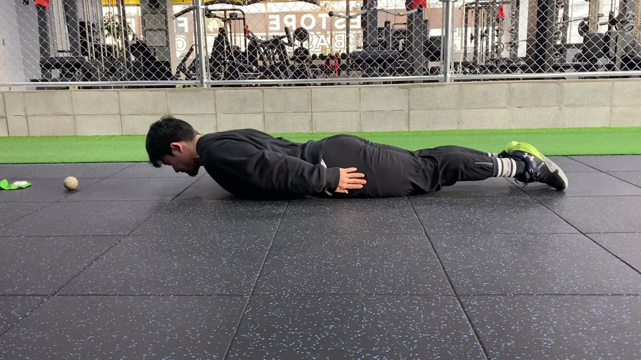 Prone Arch up with hands by sides