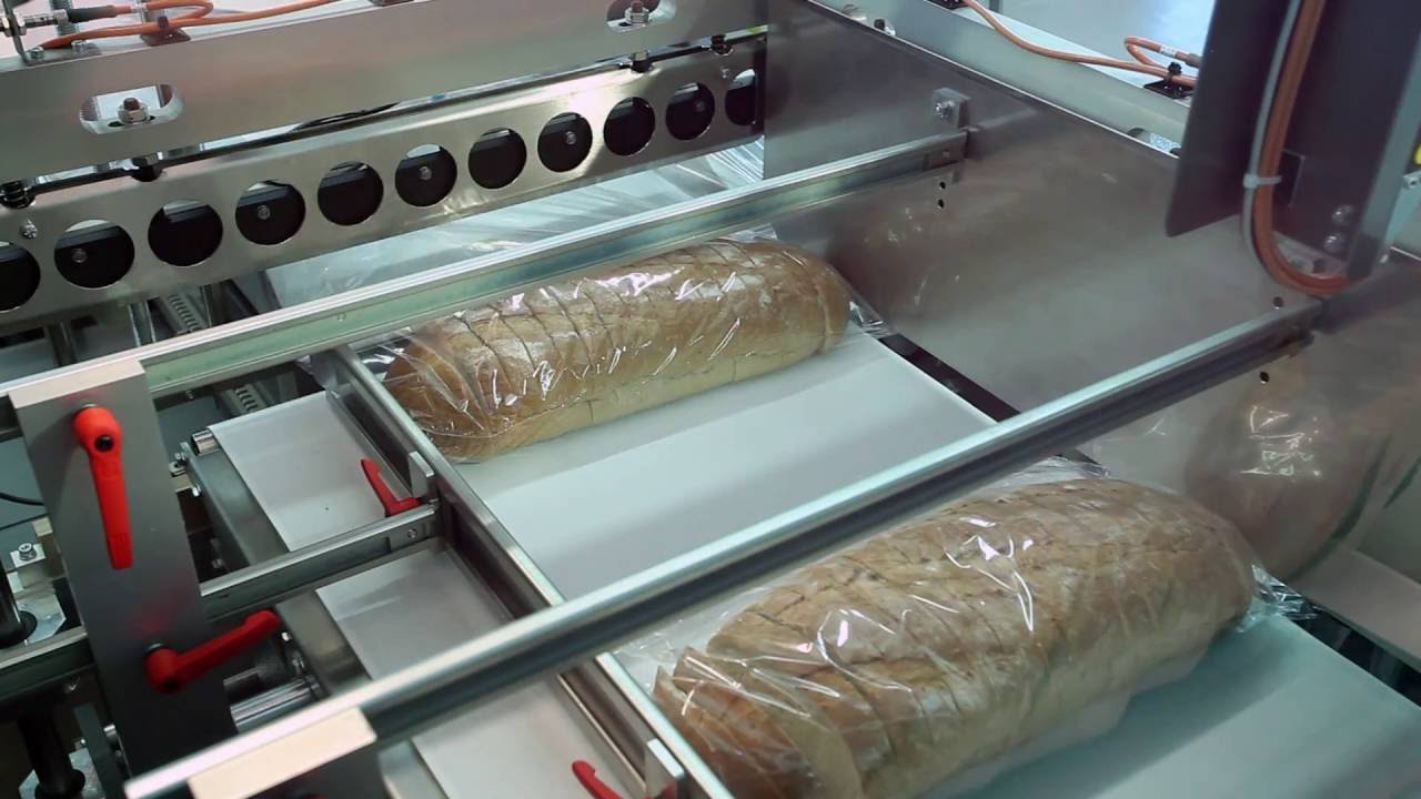 Sliced bread shrink wrapping - automatic L-sealer
