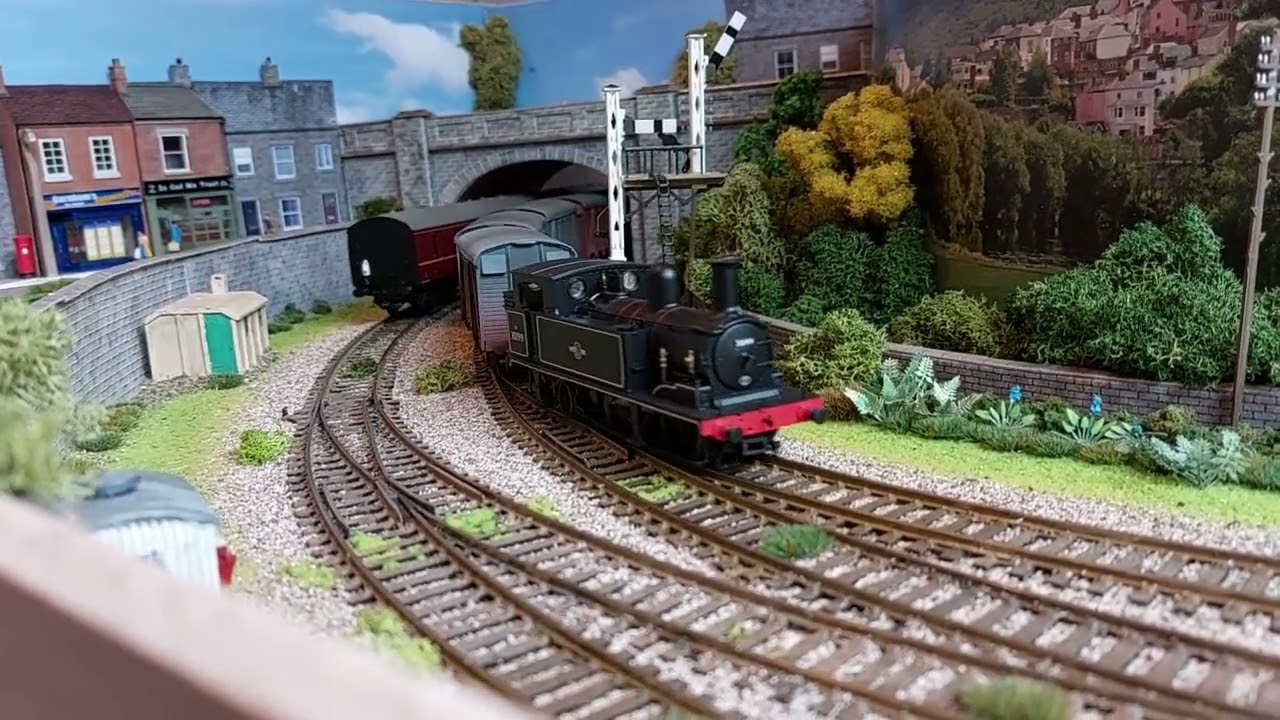 Small circular 00 gauge model railway layout.