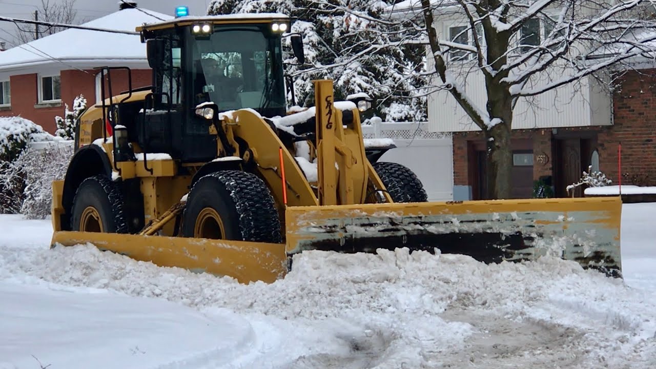 Snow Removal CAT Loader Plowing Heavy Snow