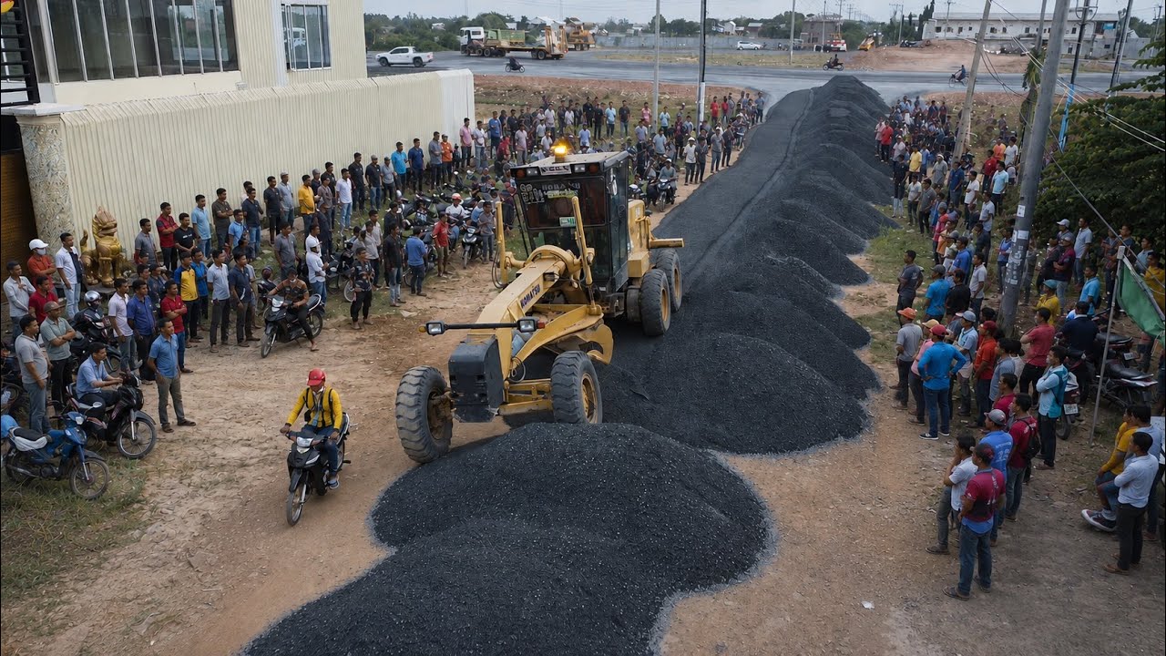 Motor Grader Clearing Gravel Coverage Road In Village