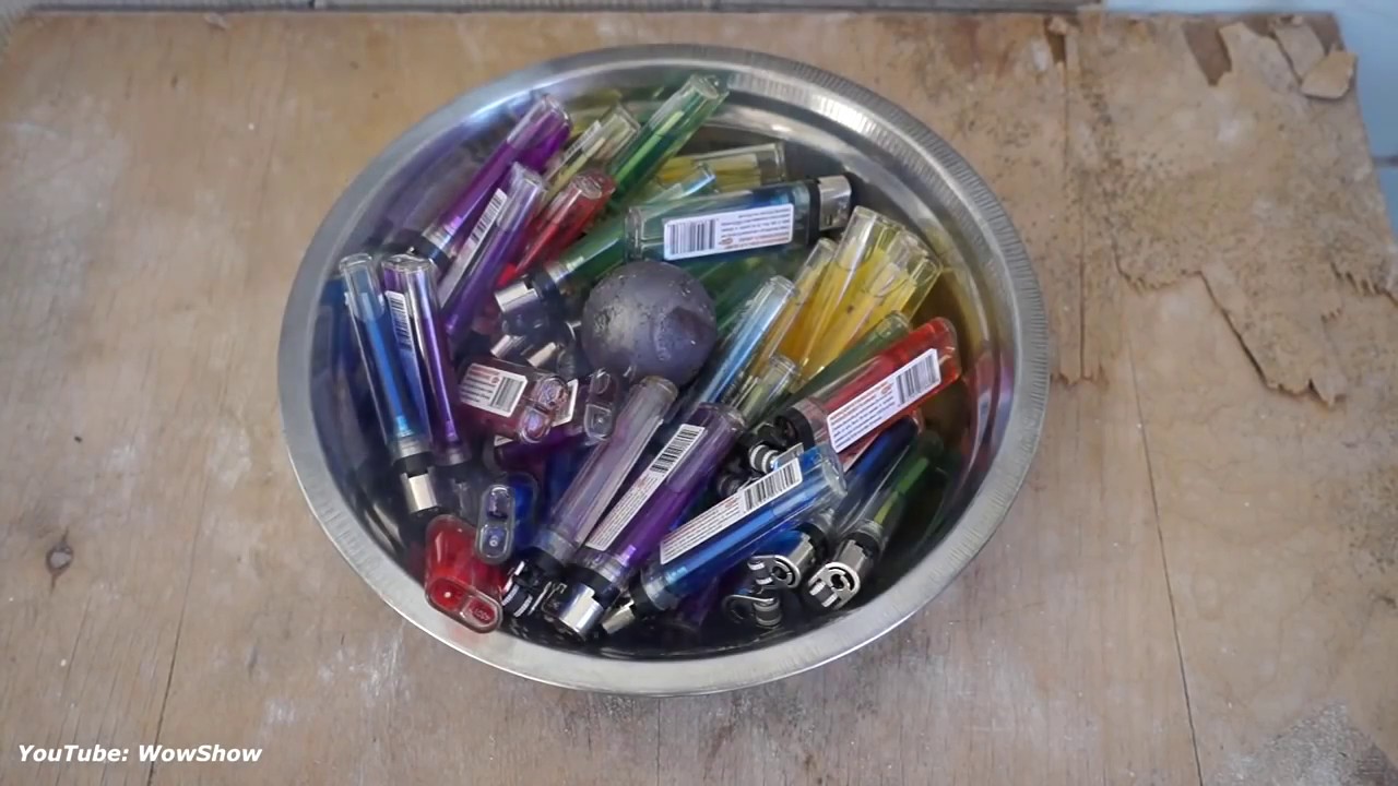 EXPERIMENT GLOWING 700 DEGREE METAL BALL VS 50 LIGHTERS
