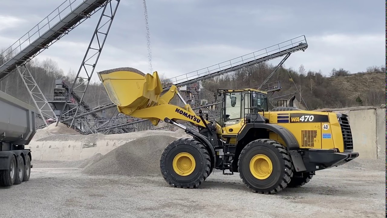 Komatsu WA470-8 loading trucks in a rock quarry