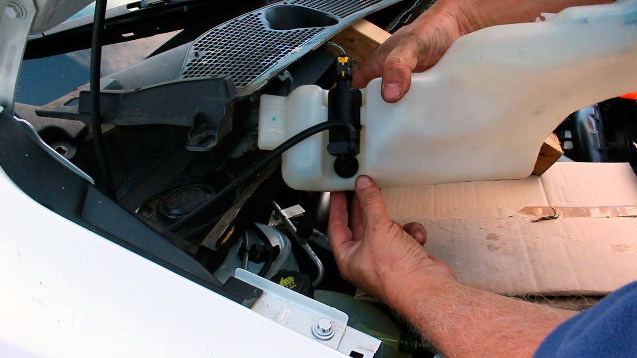 Save Money !!! How To Replace a Windshield Washer Pump Dacia Dokker 2013 +.