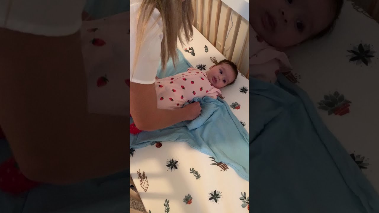 How to swaddle a newborn using the Miracle Blanket.