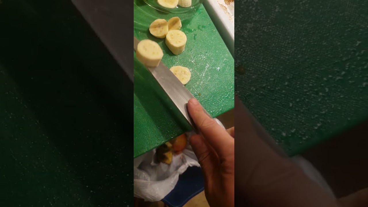 Making a Simple Dessert With Truffle Chocolate Heated Up Put It over Some Small Bananas Part 1