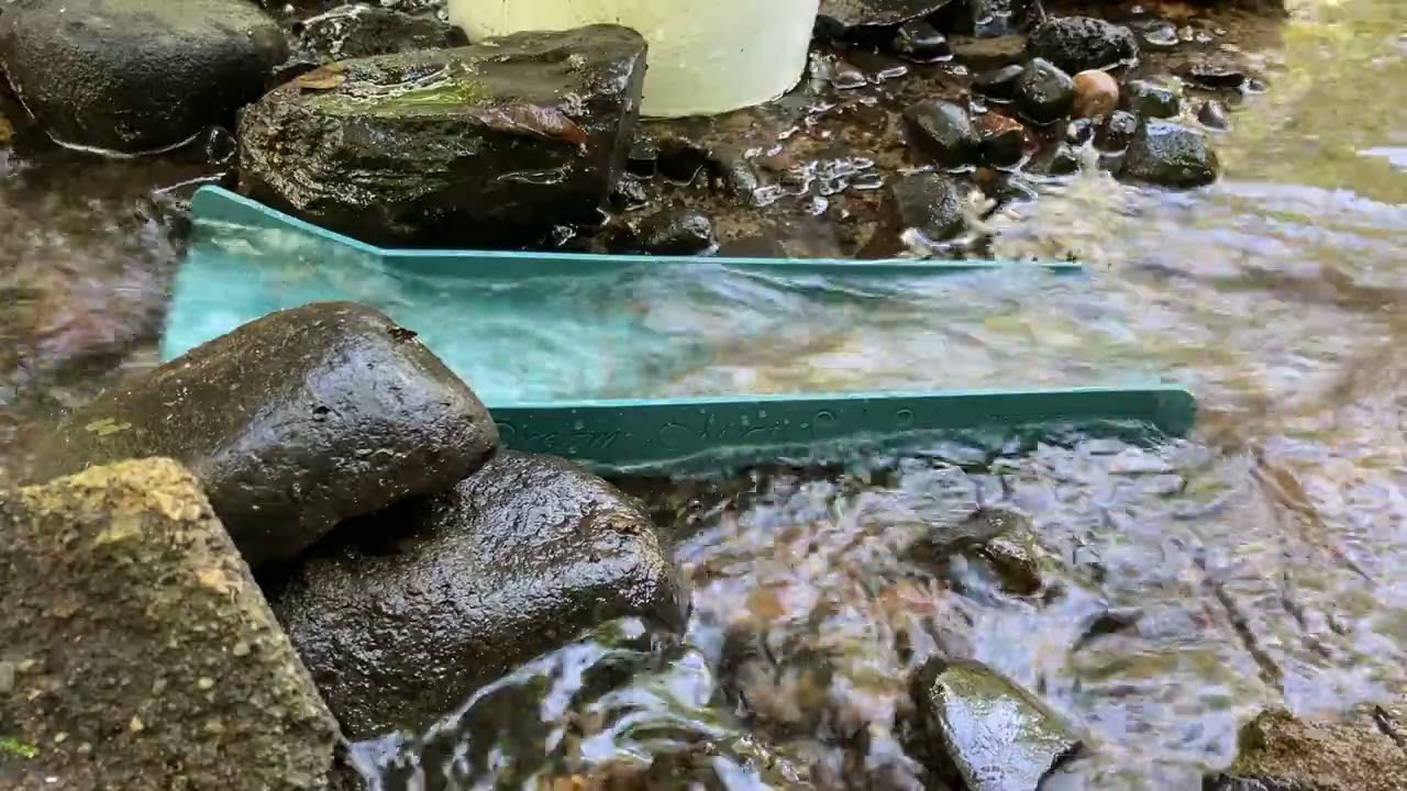 Playing in the creek with the Adventure Sluice.