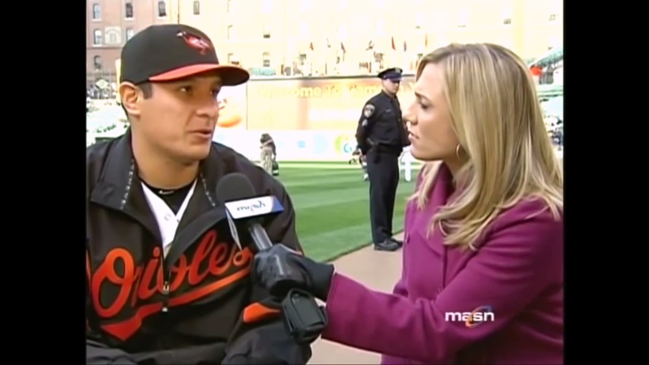 blonde reporter in leather gloves