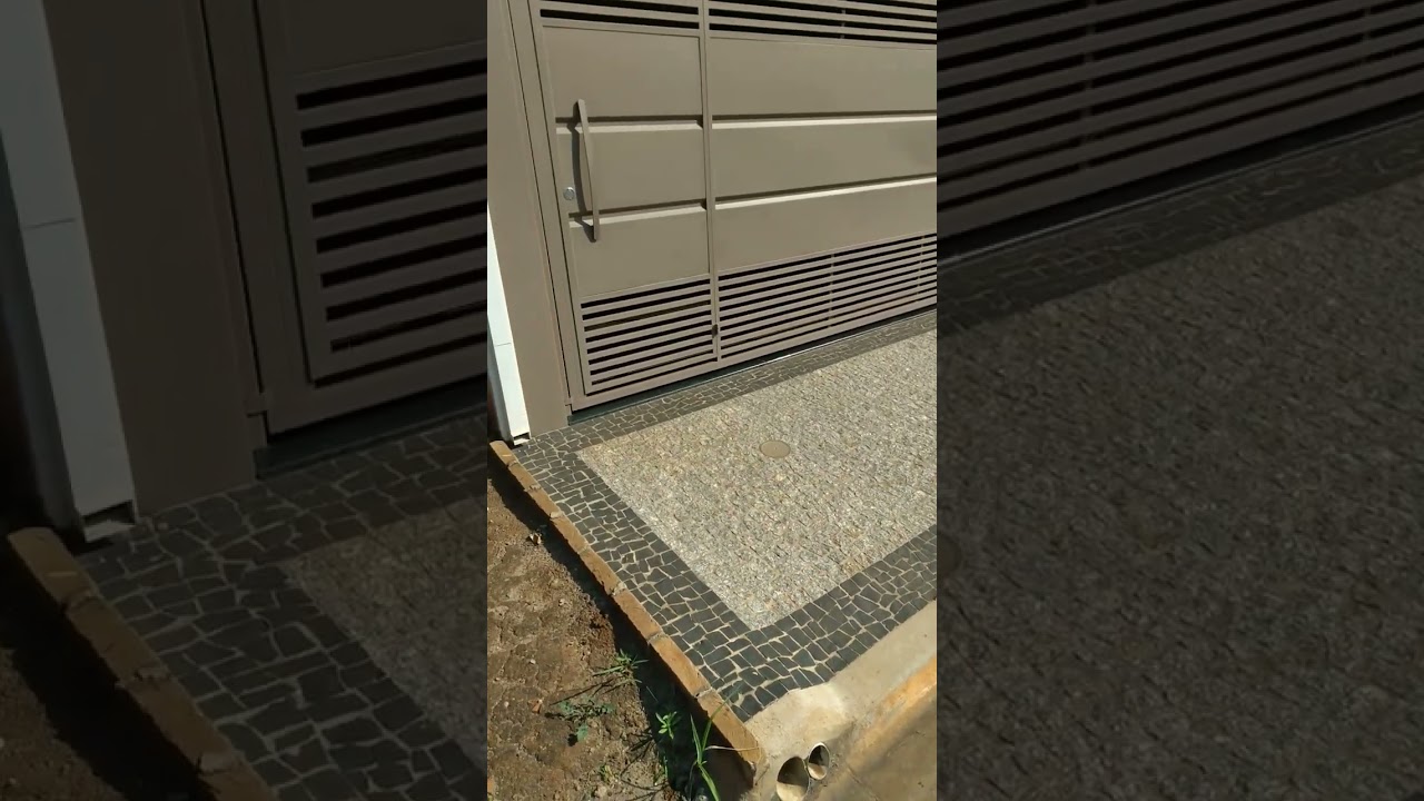 cal&ccedil;ada feita com granitinho cinza com a borda de pedra preta