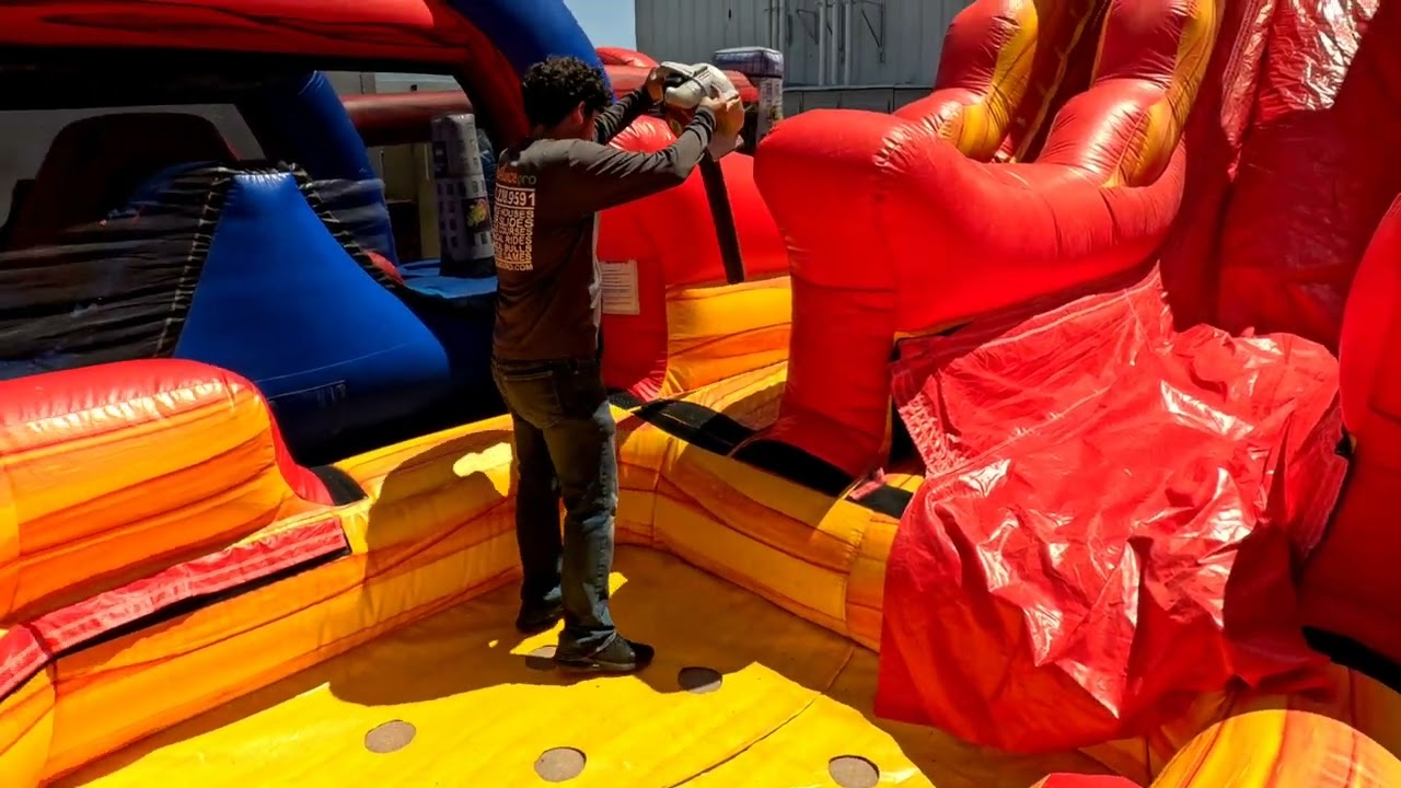 Cleaning the bounce house and water slides