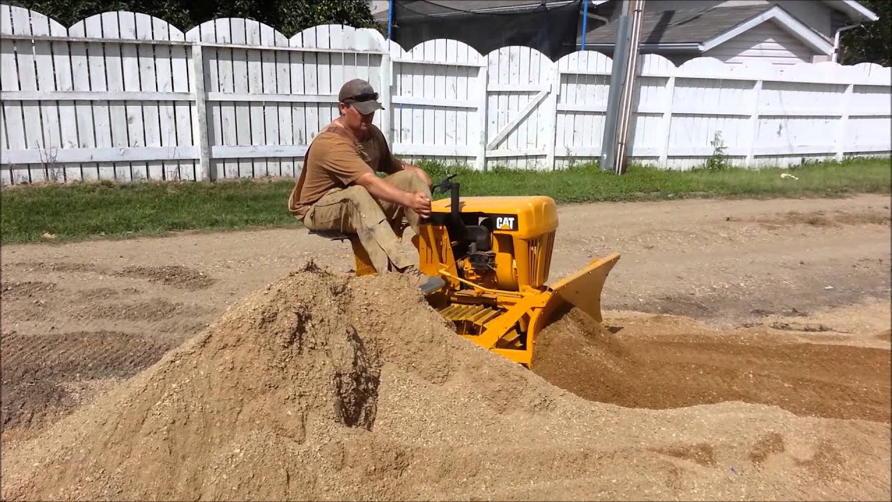 CAT Mini Dozer Pushing Dirt