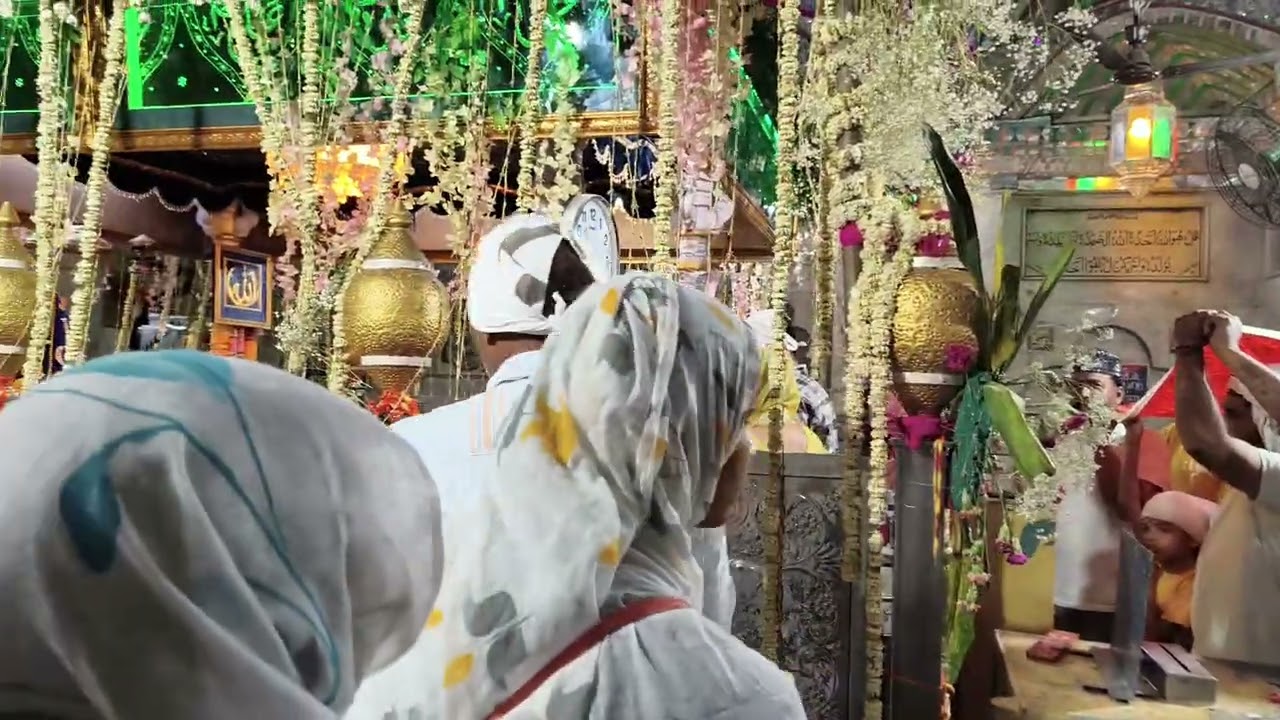 Devotees offering chadar at dargah Bu Qalandar Shah Panipati. 