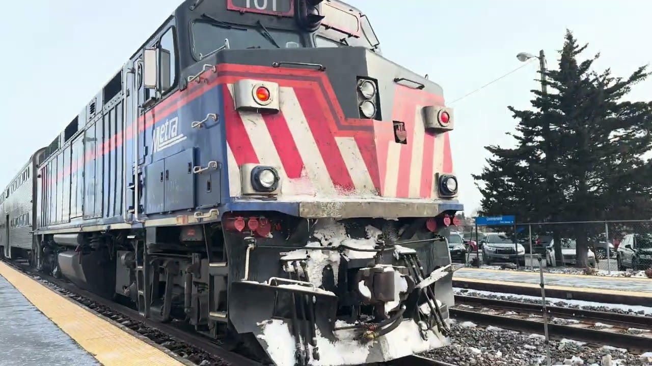 Metra 101 trails an inbound Metra train at Cumberland Station