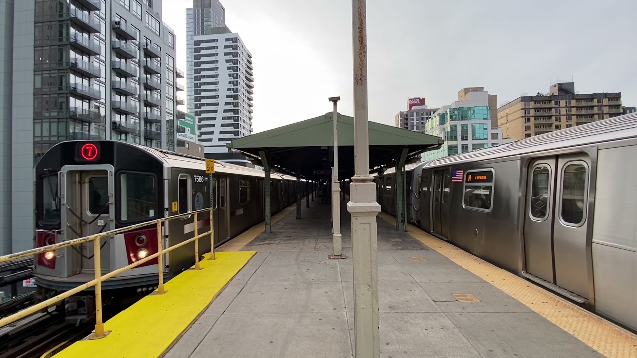 R188 (7) Train and R160 (N) Train leave Queensboro Plaza at the same time