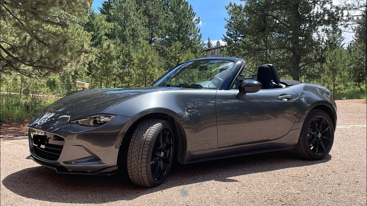 Spirited driving. Great sounding 2 liter MX-5 nd. West Platte, north of Pike's Peak. Late summer.