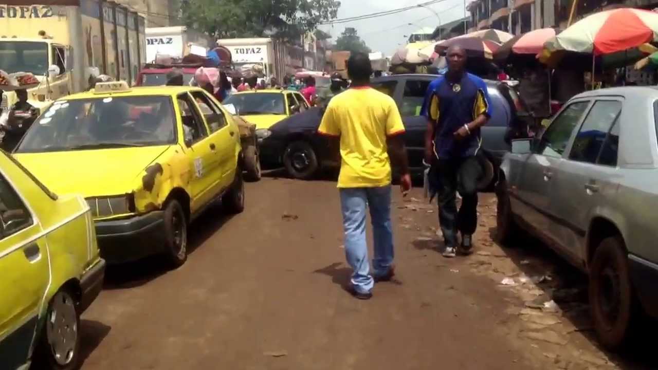 Walking down Route du Niger, Avaria neighborhood, Conakry, Guinea