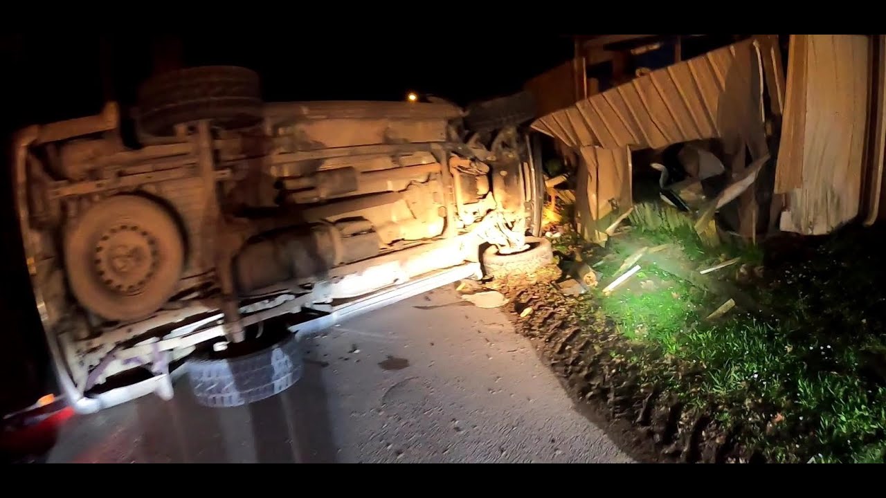TRUCK VS HOUSE....  TRUCK ROLLS INTO SIDE OF HOUSE AND EVERYONE WALKS AWAY.