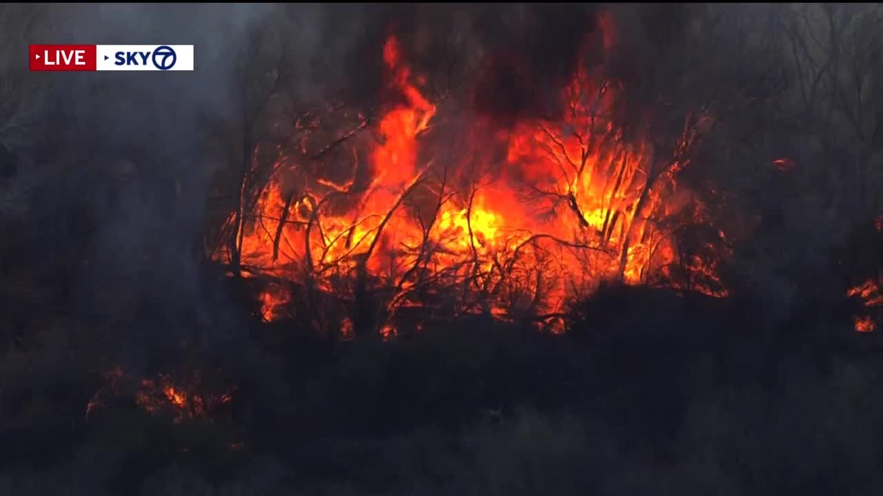 Sky 7 flies over bosque fire south of Rio Communities