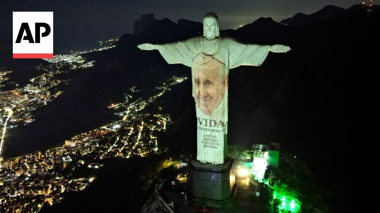 Christ the Redeemer illuminated with image of Pope Francis