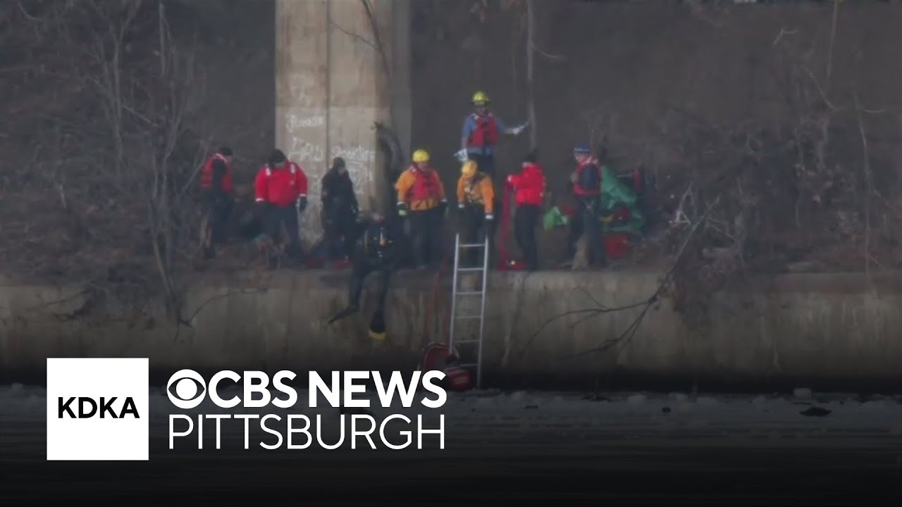 Woman taken to hospital after vehicle plunges into icy river