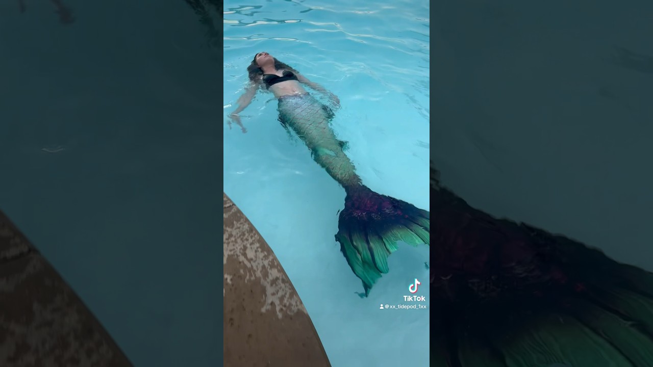 Mermaid relaxing in a local pool 