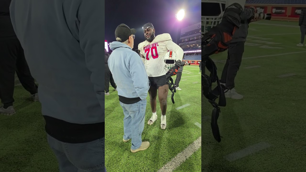 Scott talks with Markel Bell OL from Miami at the Senior Bowl Practice