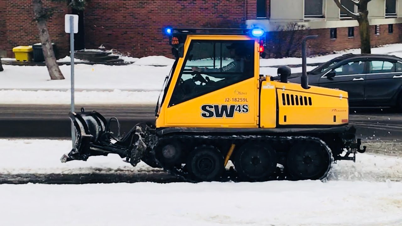 Snow Removal Bombardier SW4s Plowing Snow