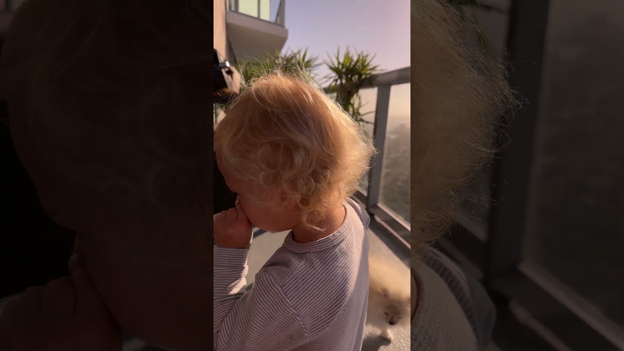 Little David is playing on the balcony. Cute Baby Shorts! 