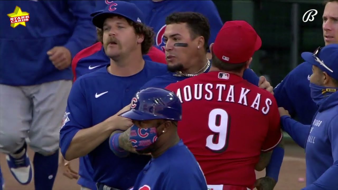 Amir Garrett, Javier Baez have to be held back as Reds and Cubs benches clear
