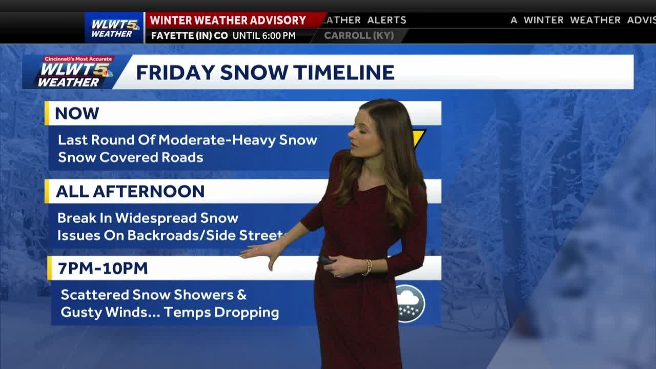 Heavy snow moves out, leaving roads covered