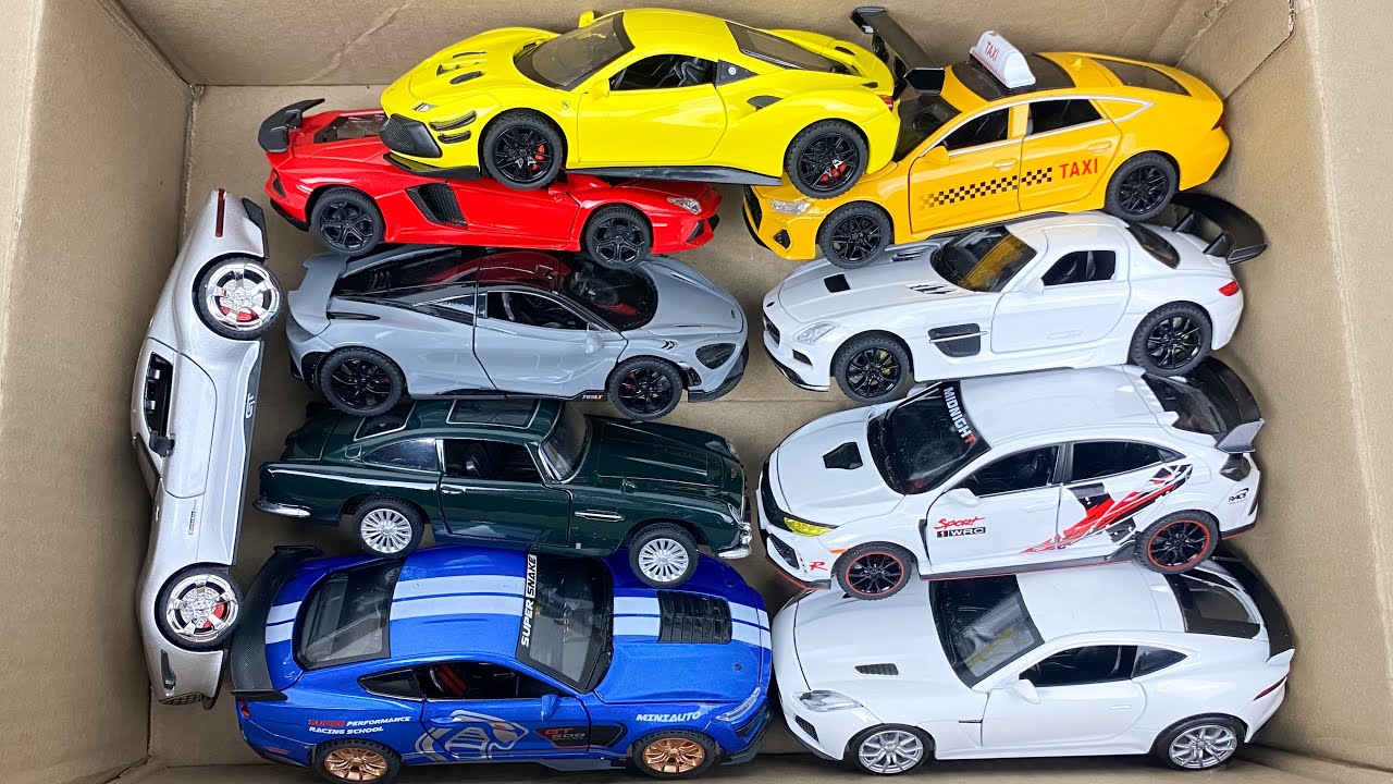 Box Full of Model Cars -Tesla Robotaxi, Tesla Cybertruck, Tesla Roadster, Lexus LC500, Lexus Lm 300h