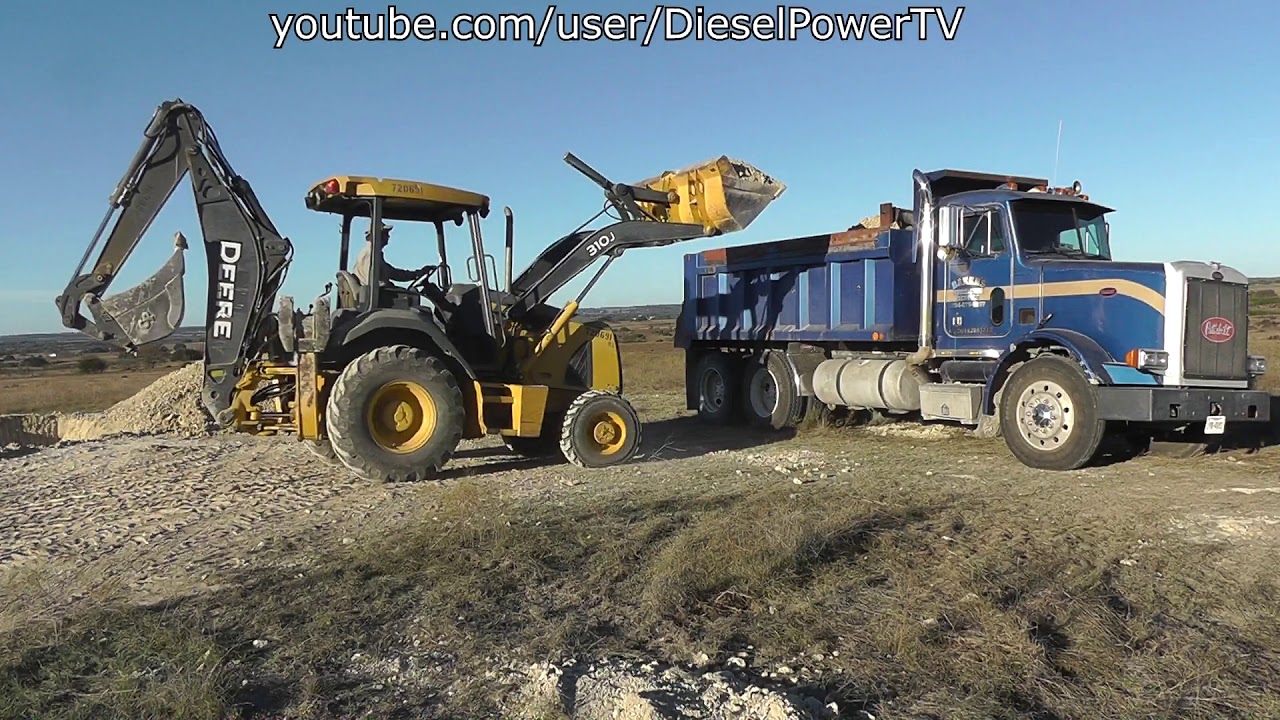 Loading Peterbilt Dump Truck With JD 310J Backhoe