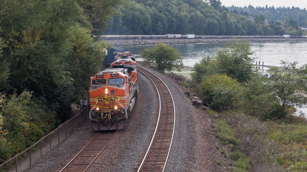 (4K) Two Trains along Puget Sound at Carkeek Park.