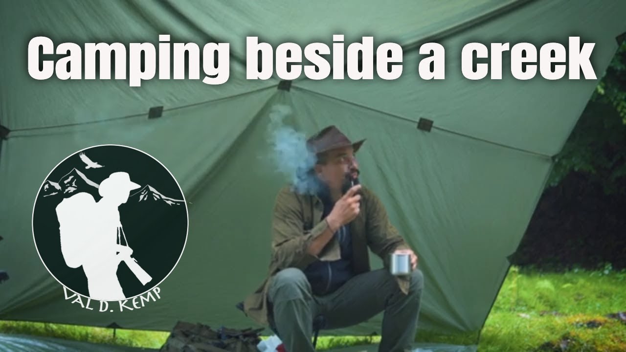 Bushcraft camp on a creekside, morning rain | tarp shelter, cooking skewers, wood spirit carving