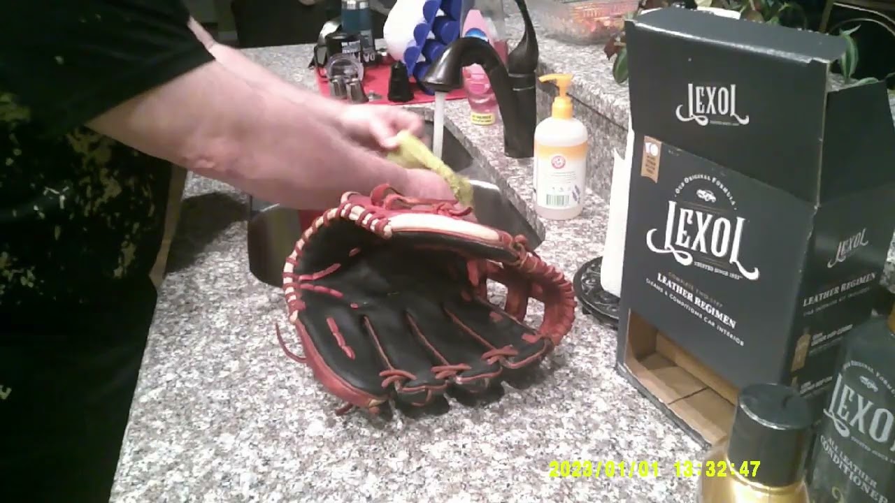 Clean/Condition Travis dirty glove using Lexol leather cleaner and conditioner.