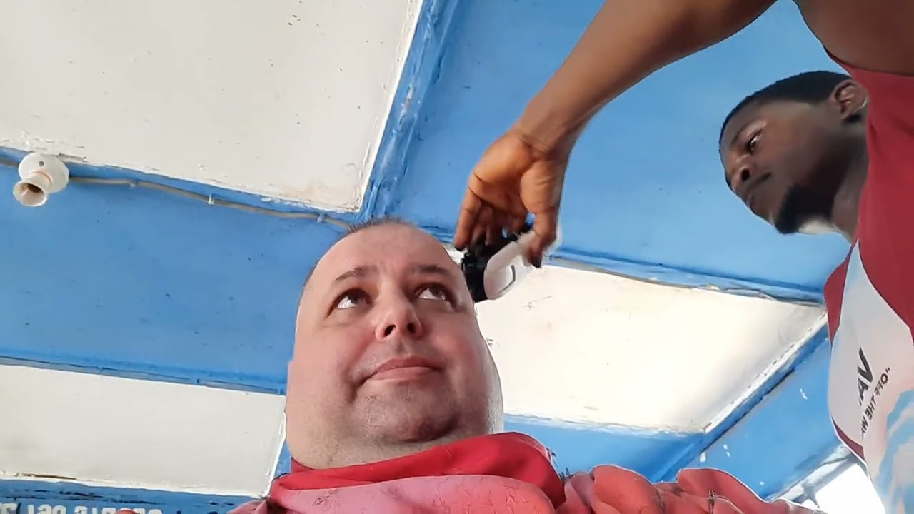 Sierra Leone West Africa - AT THE LOCAL BARBER GETTING A NEW SHAVE AND A HAIRCUT FOR 1$