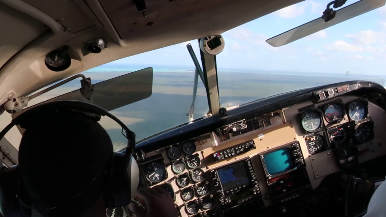 Landing at Mangrove Cay in a Flamingo Air Beech 99